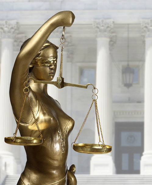 Justice lady in front of courthouse